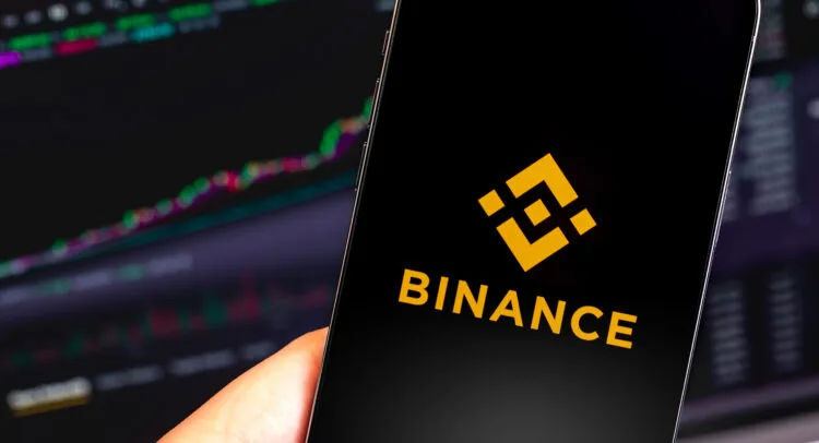 Binance logo and Changpeng Zhao with legal documents.